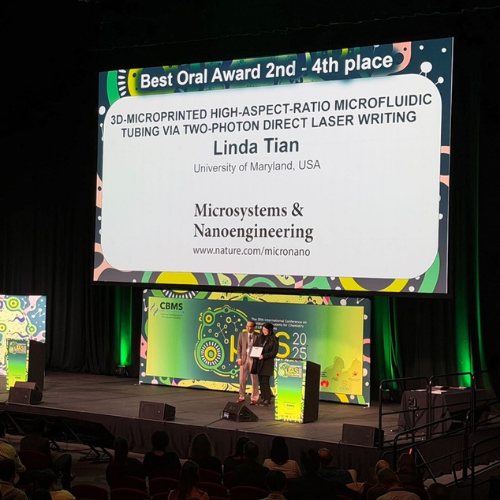 Linda Tian receiving Oral Presentation Award at MicroTAS 2025